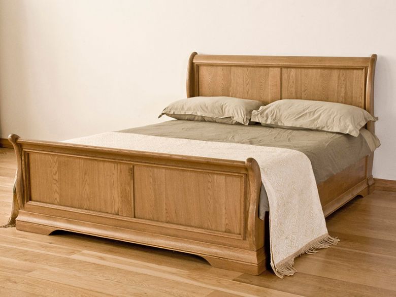Flagbury solid oak sleigh bed available at Furniture Barn